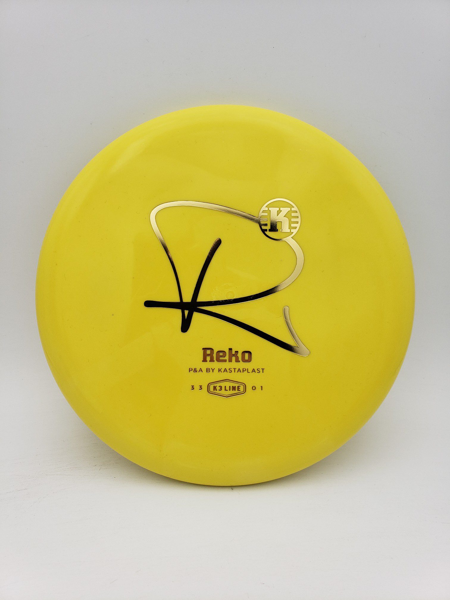 Kastaplast K3 Reko yellow disc golf disc front view
