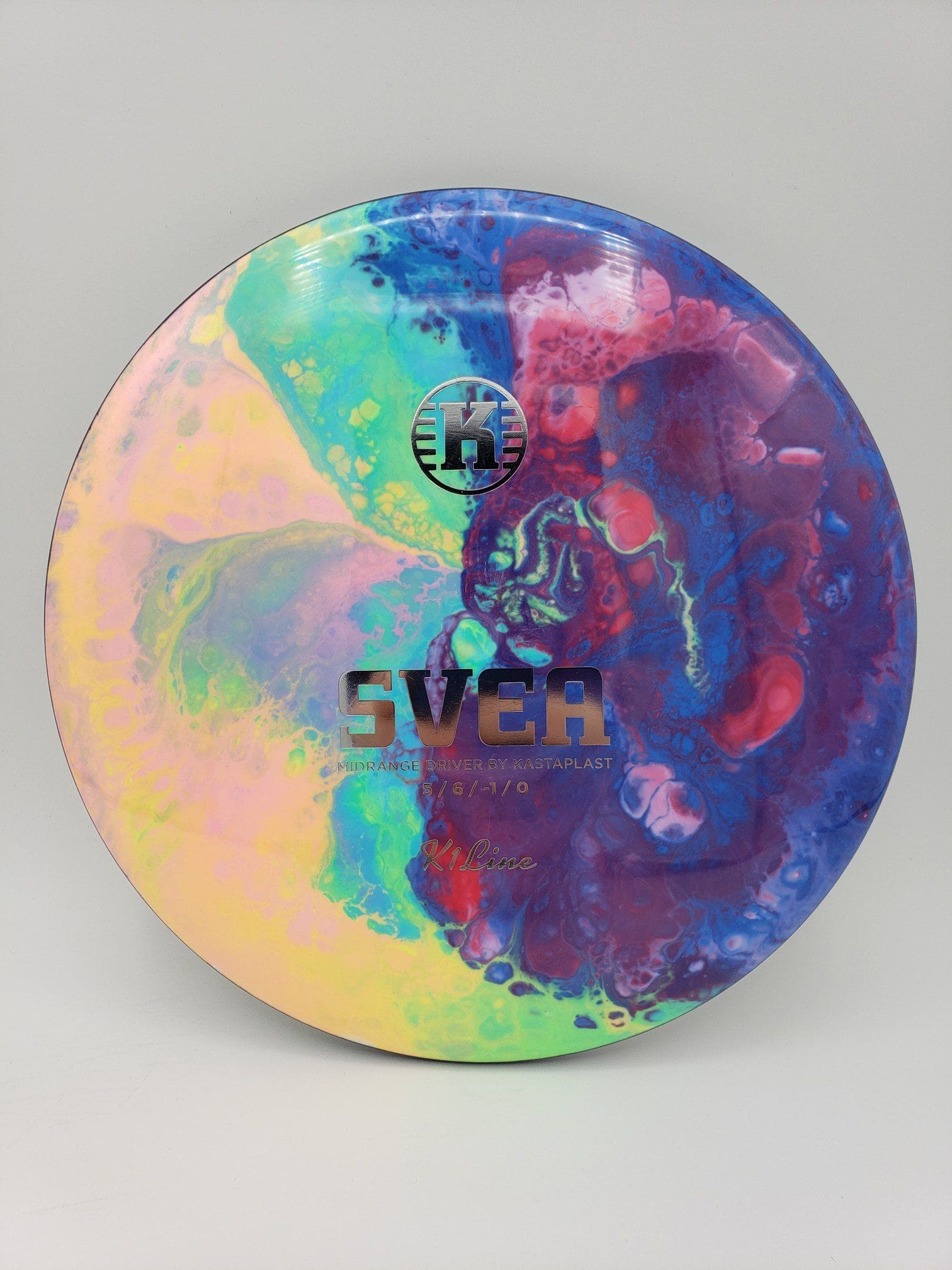 Mad Hatter Dyes volume 1 disc golf disc side view
