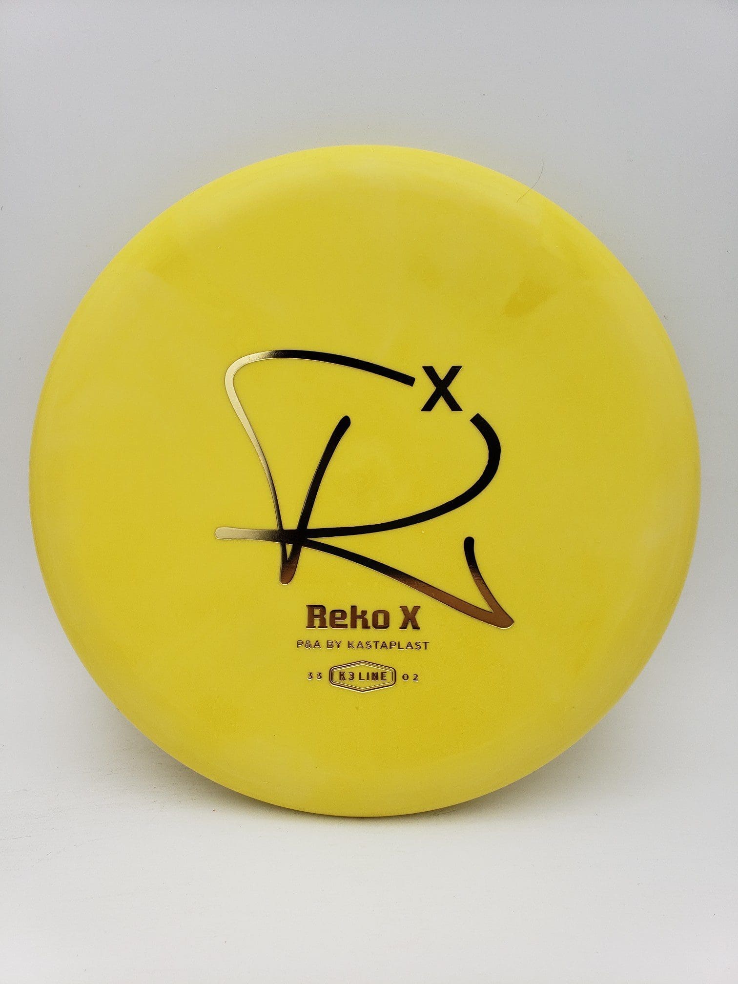 Kastaplast K3 Reko X yellow disc golf disc front view