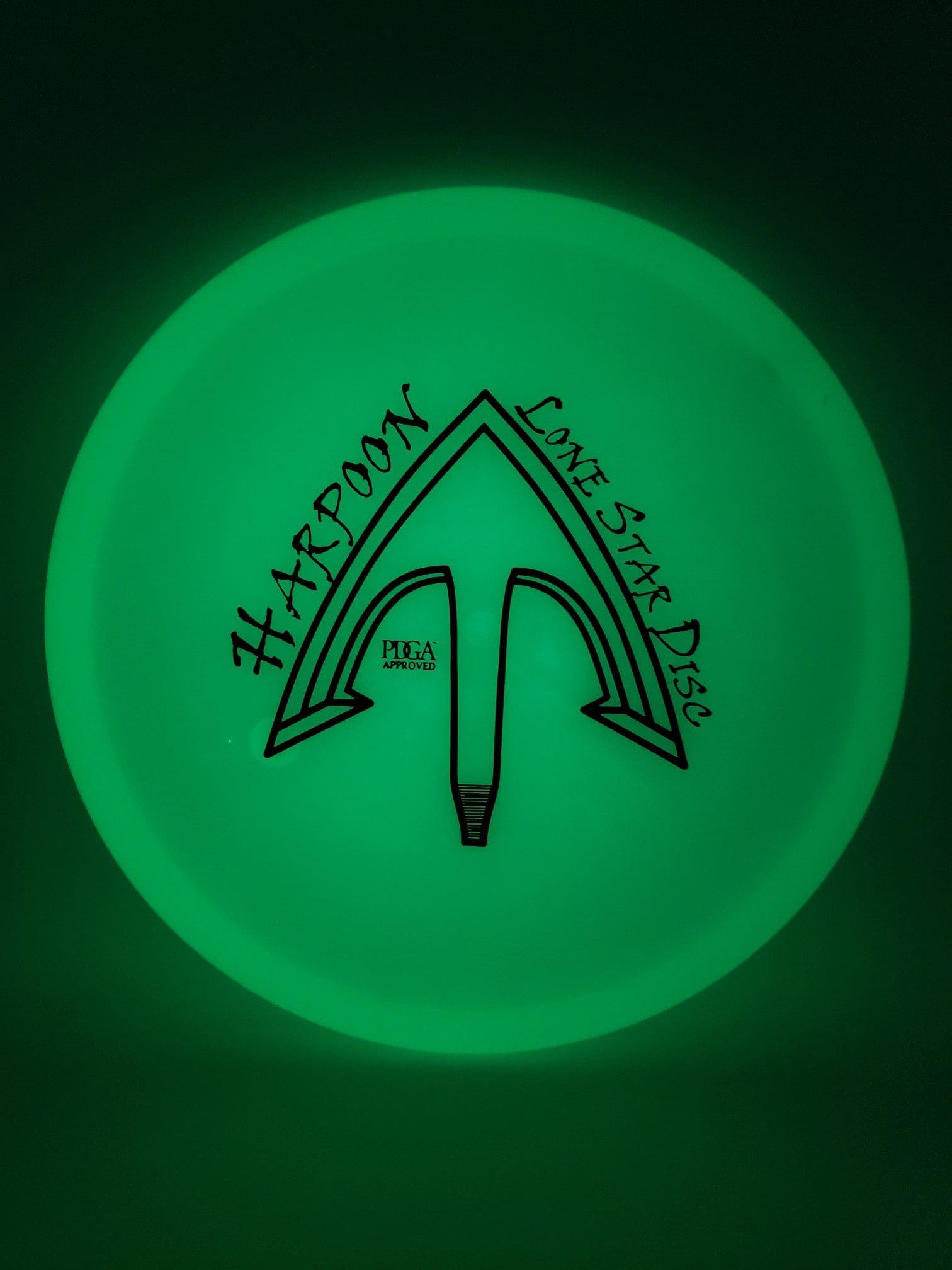 LSD Glow Harpoon disc golf disc front view