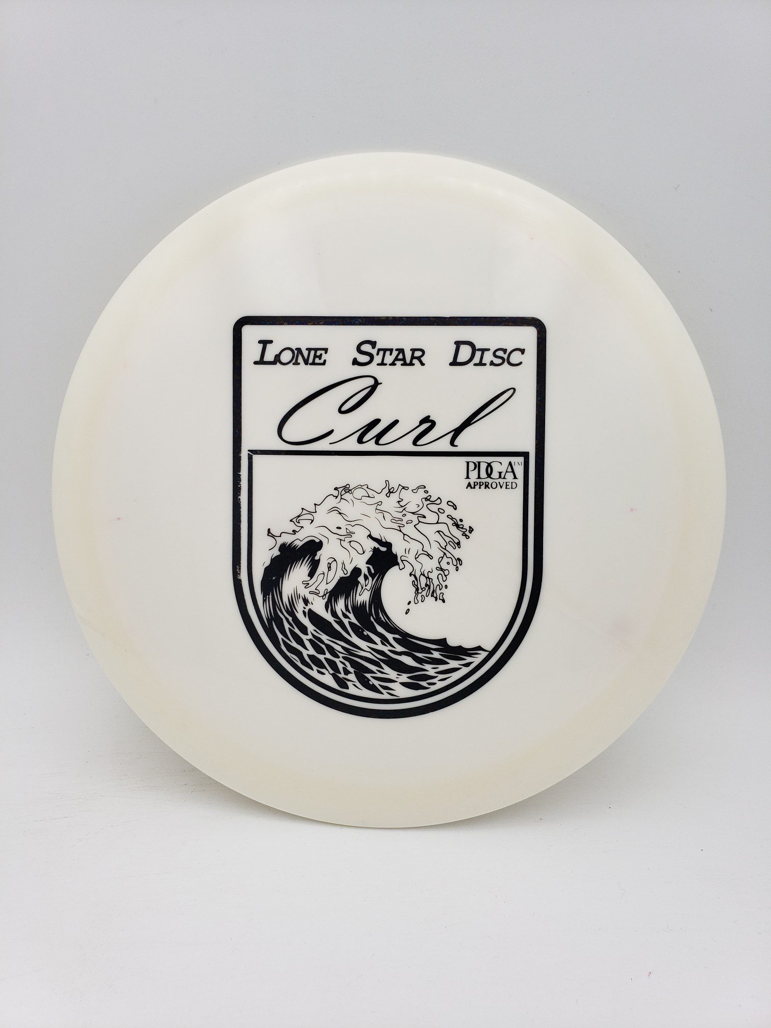 LSD Alpha Curl disc golf disc front view