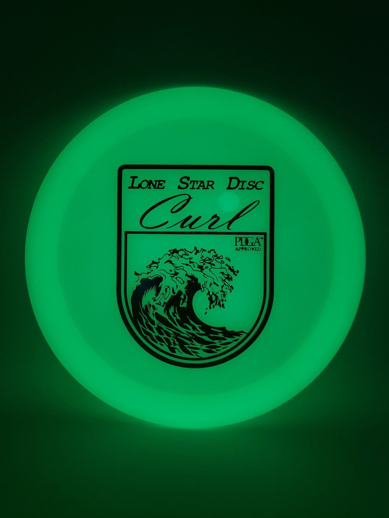 LSD Glow Curl disc golf disc front view