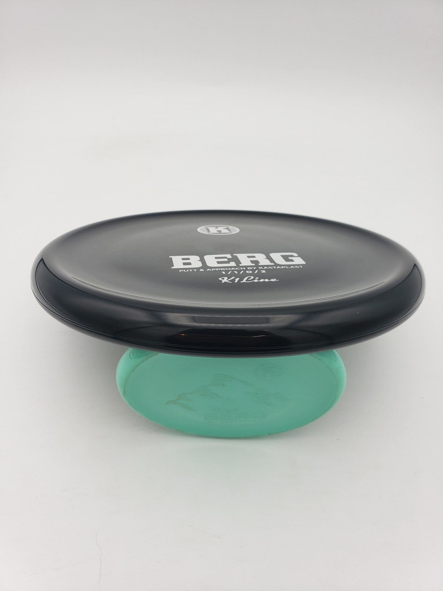 Kastaplast K1 REGRIND Berg black disc golf disc back view