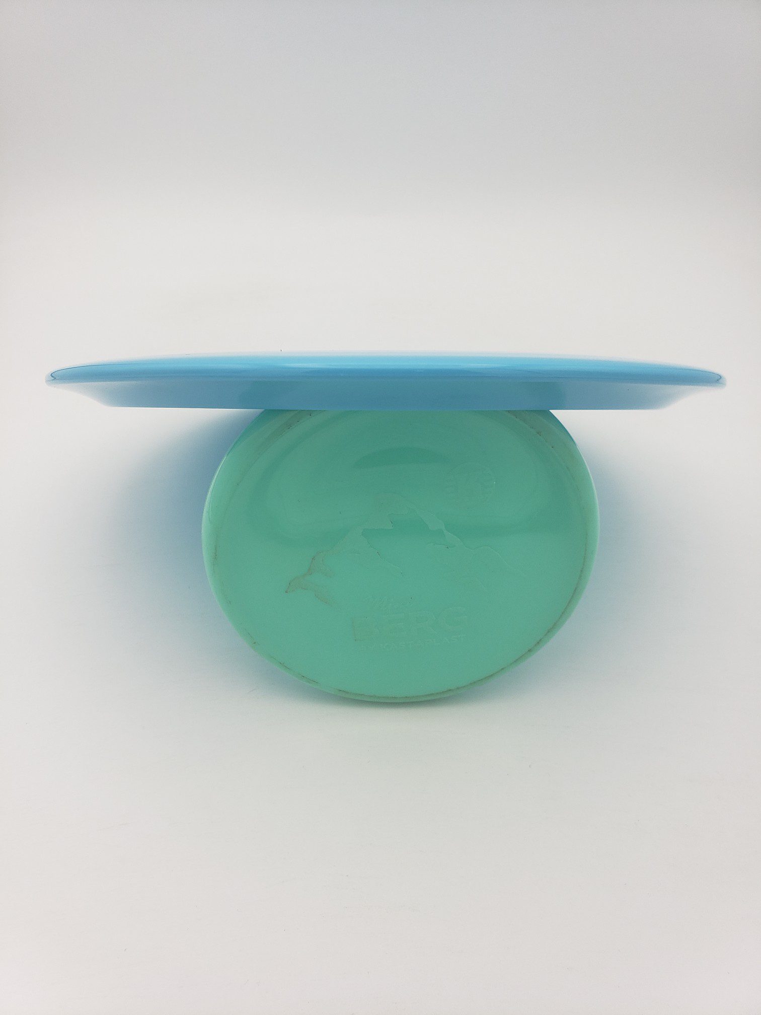 Lft Discs Xenon Alpha-solid teal disc golf disc back view