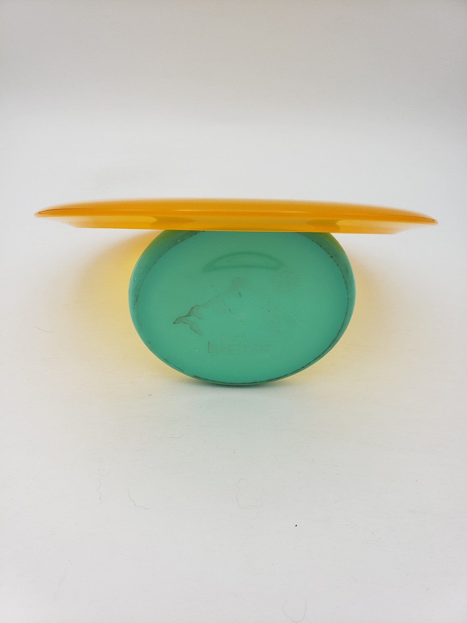 Kastaplast K1 Grym translucent orange disc golf disc back view