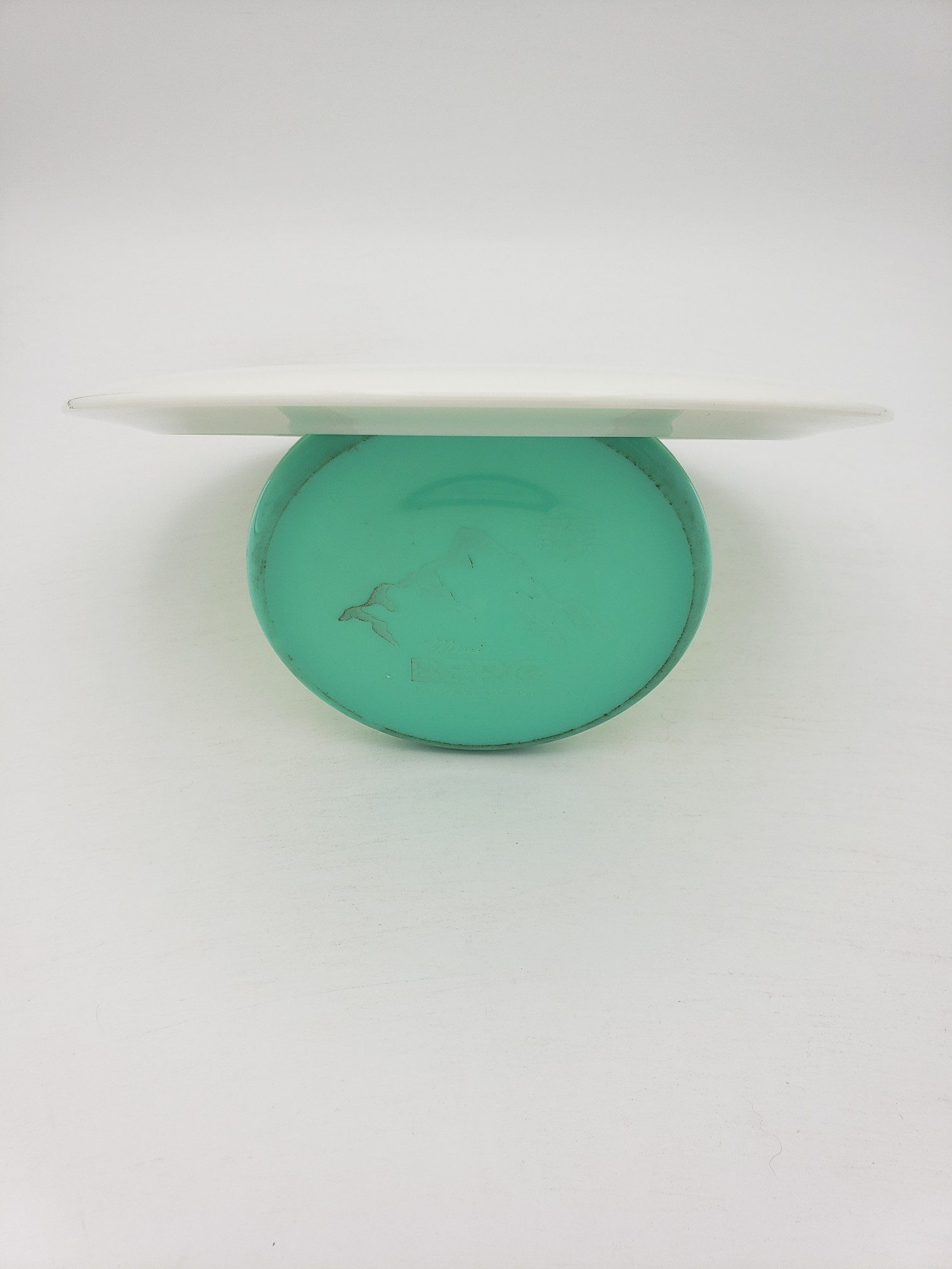 Innova bottom stamped white Star Destroyer disc golf disc back view