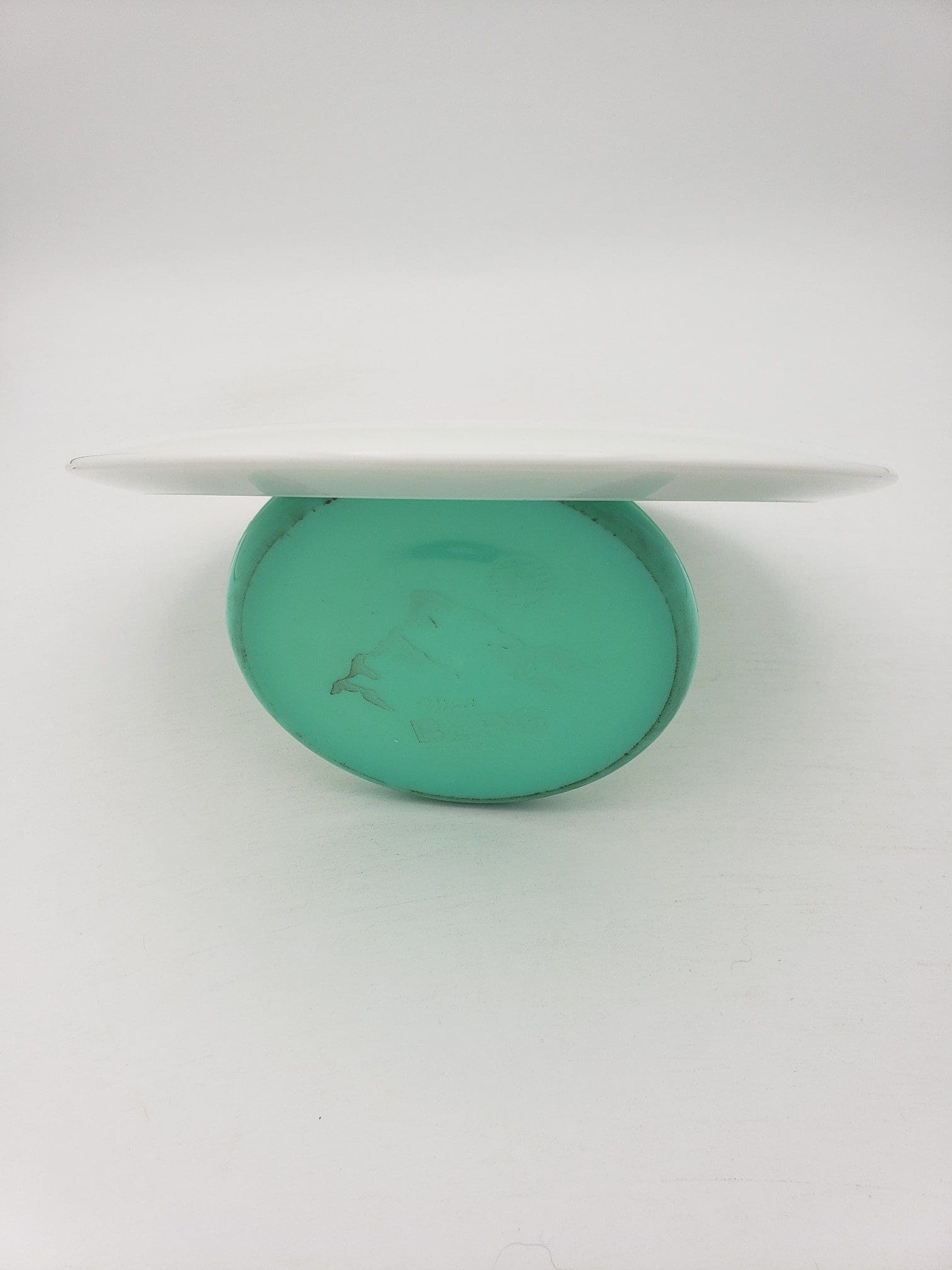 Innova bottom stamped white Star Roadrunner disc golf disc back view