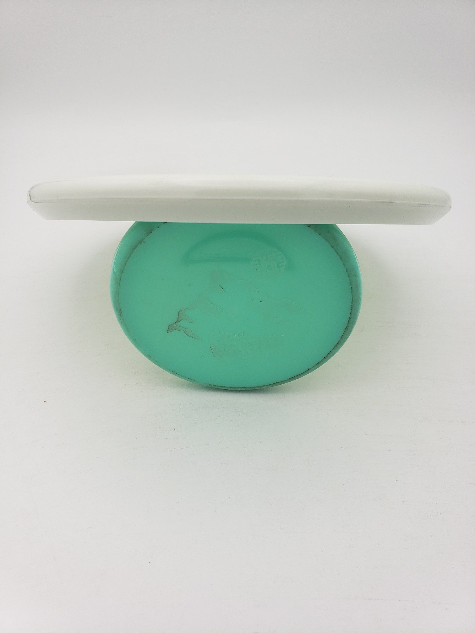 Innova bottom stamped white Star Toro disc golf disc back view