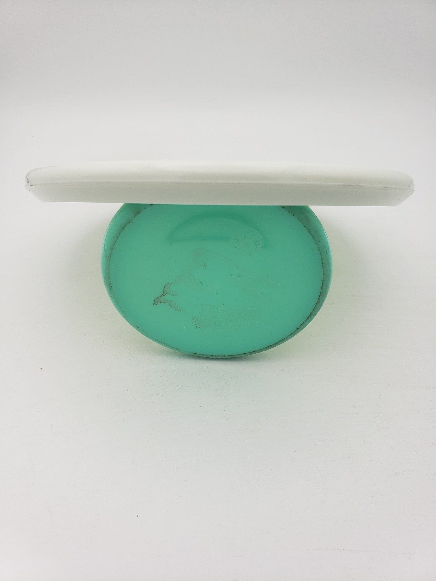 Innova bottom stamped white Star Toro disc golf disc back view