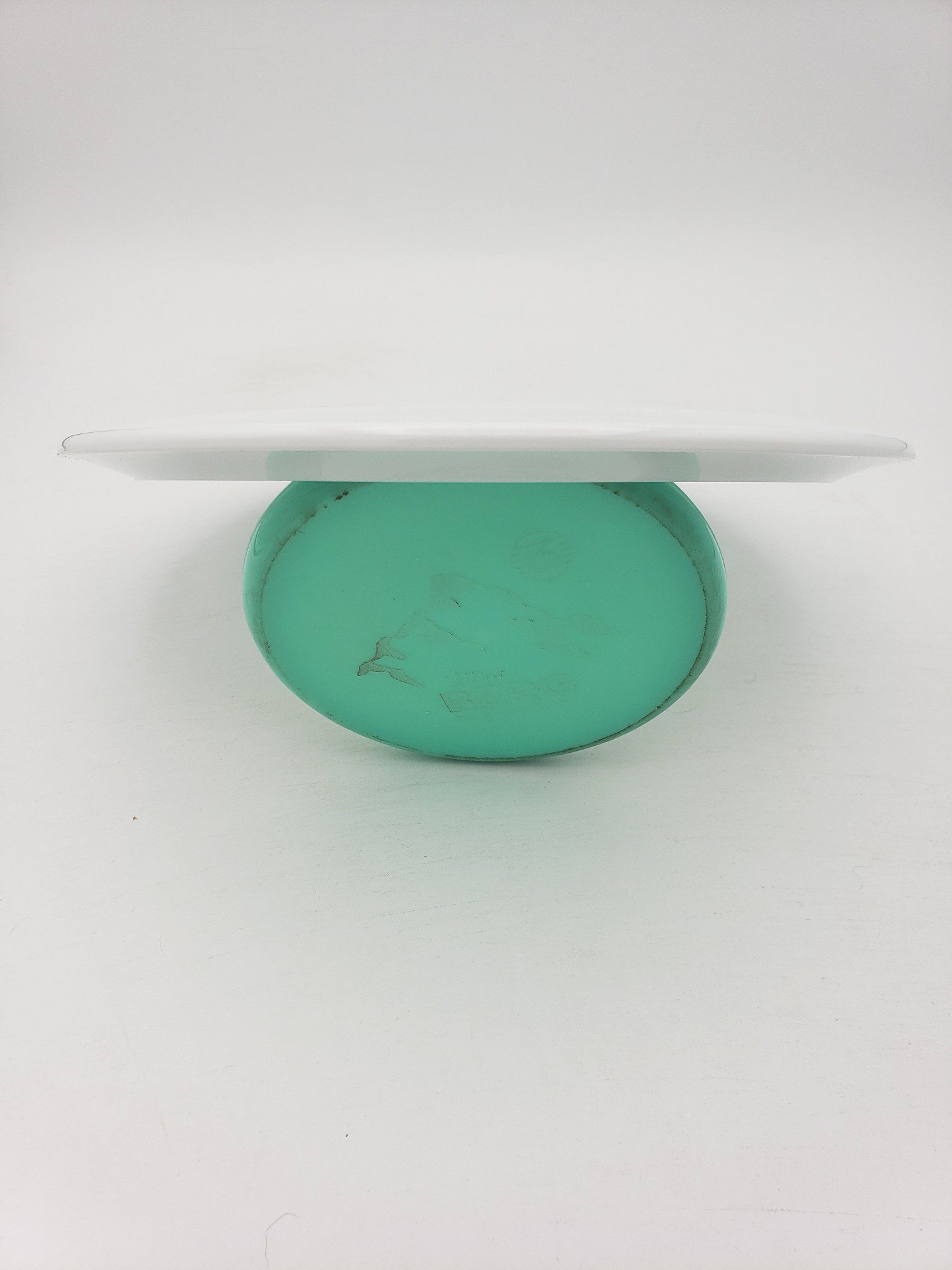 Innova bottom stamped white Star Firebird disc golf disc back view